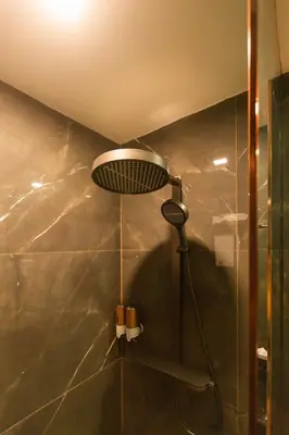a shower with a shower head in a bathroom at Syama V Beachfront Resort Ao Nang Krabi, Aspira Collection - Adults Only in Ao Nang Beach