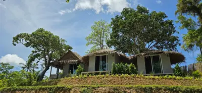 a house with a thatched roof on a hill at Krabi Sea View Orchid Beach room in Krabi town