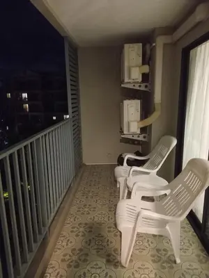 a balcony with two white chairs and a window at В10 Title 2-bedroom 86м2 ВатСaп66935B2I976 in Nai Yang Beach
