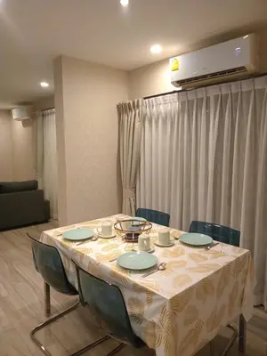 a dining room table with chairs and a white table cloth at В10 Title 2-bedroom 86м2 ВатСaп66935B2I976 in Nai Yang Beach
