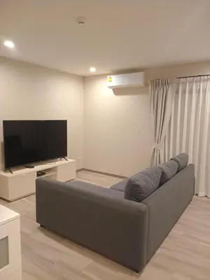 a living room with a couch and a flat screen tv at В10 Title 2-bedroom 86м2 ВатСaп66935B2I976 in Nai Yang Beach
