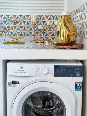 a white washing machine with a vase on top of it at Townhouse Bellano 3BR FamilyLaguna Park Bang Tao in Laguna Phuket