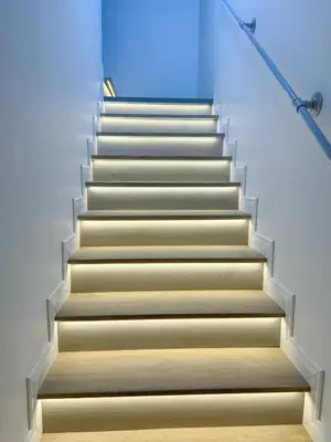 a staircase in a building with a blue background at Townhouse Bellano 3BR FamilyLaguna Park Bang Tao in Laguna Phuket