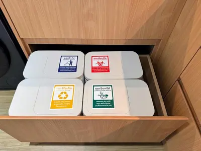 four plates in a drawer of a cabinet at Laguna Beachside Residences by Beringela in Bang Tao Beach