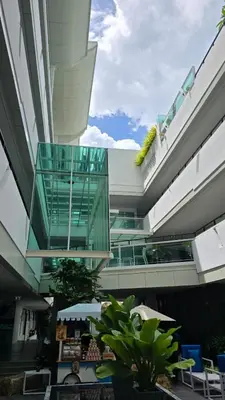 a view of a building with a glass elevator at Chalong Marina Bay View by SP in Ban Bang Chak