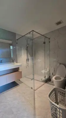 a bathroom with a shower and a toilet and a sink at Chalong Marina Bay View by SP in Ban Bang Chak
