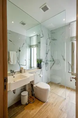 a bathroom with a sink and a toilet and a mirror at Khanaen Luxury Pool Villa by SP in Ban Chin Tham Mai
