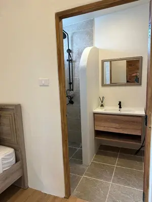 a bathroom with a sink and a shower at Chalong Home Phuket in Phuket Town