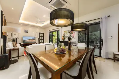 a dining room with a table and chairs at Villa Haeata 3BR Private Pool Nai Harn Beach in Nai Harn Beach