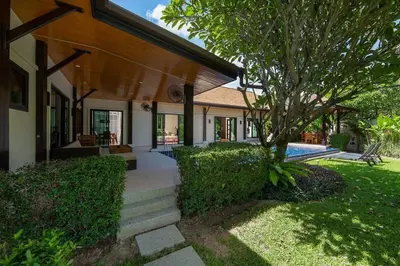 a house with a walkway leading into a yard at Villa Haeata 3BR Private Pool Nai Harn Beach in Nai Harn Beach