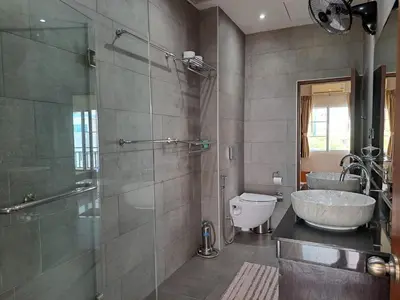 a bathroom with a shower and a sink and a toilet at Rawai Seaview Pool Townhouse in Rawai Beach