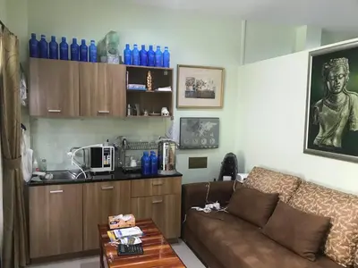 a living room with a couch and a table at Rawai Seaview Pool Townhouse in Rawai Beach