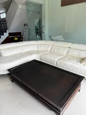 a white leather couch in a living room at Rawai Seaview Pool Townhouse in Rawai Beach