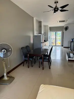 a kitchen and dining room with a table and chairs at Rawai Seaview Pool Townhouse in Rawai Beach