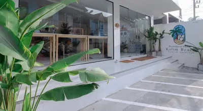 a store front with a plant in front of it at RQ Phuket Kalim Beach Blue Horizon in Patong Beach