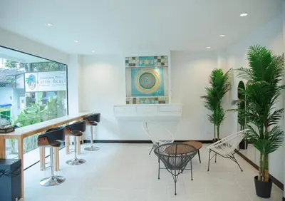 a waiting room with chairs and a counter in a store at RQ Phuket Kalim Beach Blue Horizon in Patong Beach