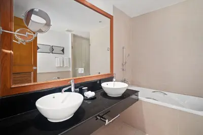 a bathroom with two sinks and a large mirror at Laguna Village 2 Bedroom Pool View Villa by Banyan Living in Layan Beach