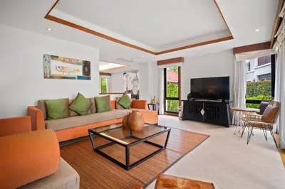 a living room with a couch and a tv at Laguna Village 2 Bedroom Pool View Villa by Banyan Living in Layan Beach