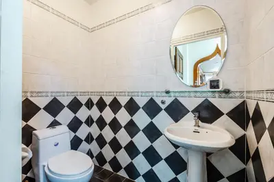 a bathroom with a sink and a mirror at Tranquility Haven Villa, Kata Beach in Kata Beach