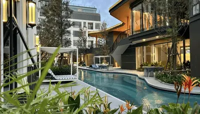 a swimming pool in the middle of a building at Bellevue Lagoon Premium Apart Hotel by TropicLook in Bang Tao Beach