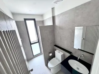 a bathroom with a toilet and a sink and a window at Bay Sand Villa by Jai House Phuket in Ban Klang