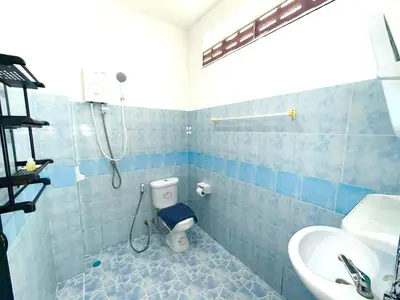 a bathroom with a shower and a toilet and a sink at Patong Canal Villa 108 in Patong Beach