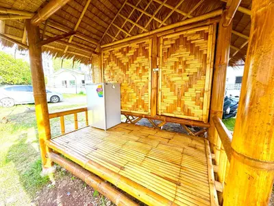 a refrigerator sitting inside of a wooden structure at Patong Canal House 1 in Patong Beach