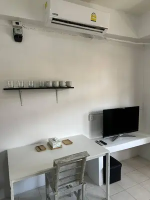a room with a white desk with a tv on it at Bestin Karon1 - 1 min from the beach, pet friendly TF in Karon Beach