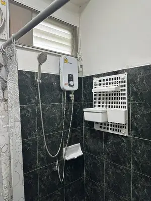 a bathroom with a shower with a blow dryer at Bestin Karon1 - 1 min from the beach, pet friendly TF in Karon Beach