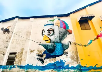a mural of a cartoon chicken on the side of a building at GO INN Phuket Old Town - โกอินน์ ภูเก็ต โอลทาวน์ in Phuket Town