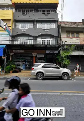 a silver car parked in front of a building at GO INN Phuket Old Town - โกอินน์ ภูเก็ต โอลทาวน์ in Phuket Town