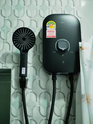 a hair dryer is attached to a wall at Borrii House โบ ลี่ เฮาท์ in Layan Beach