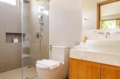 a bathroom with a toilet and a sink and a shower at Tropical Family Pool Villa - Bang Tao in Laguna Phuket