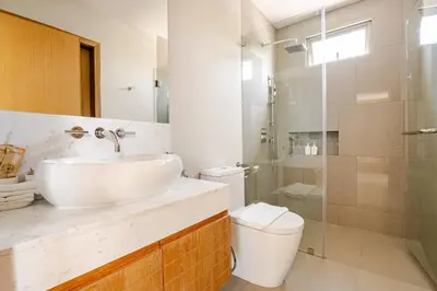 a bathroom with a sink and a toilet and a shower at Tropical Family Pool Villa - Bang Tao in Laguna Phuket