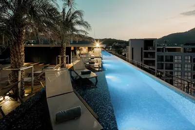 a large swimming pool on the roof of a building at Oasis in CityGate 1BR Suite in Kamala Beach