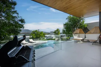 an external view of a house with a swimming pool at Villa Zavaya 360° View Luxury Retreat With Pool in Layan Beach