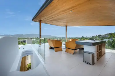 a balcony with a table and chairs on a building at Villa Zavaya 360° View Luxury Retreat With Pool in Layan Beach