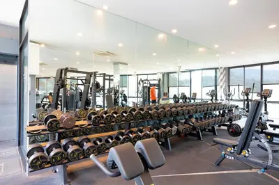 a gym with rows of dumbbells on a rack at Tropical Kamala Pool View 1 BR CTG B206 in Kamala Beach