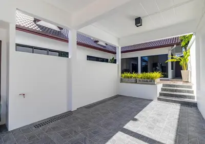 an empty house with white walls and a courtyard at Villa Junia - Quiet 3-bedroom Pool Villa in Ban Saiyuan (1)