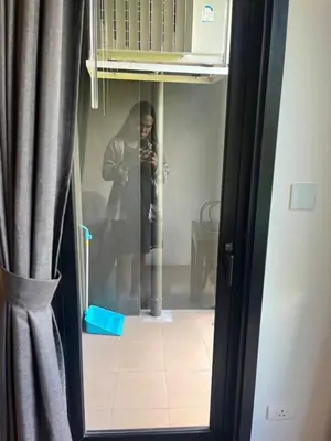 a woman taking a picture of herself in a mirror at The Base Central Phuket-B2-Y9B in Ban Rangeng