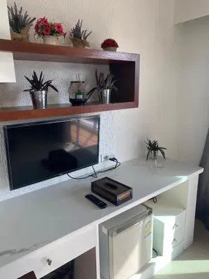 a white desk with a computer on top of it at Bestin Kata in Karon Beach