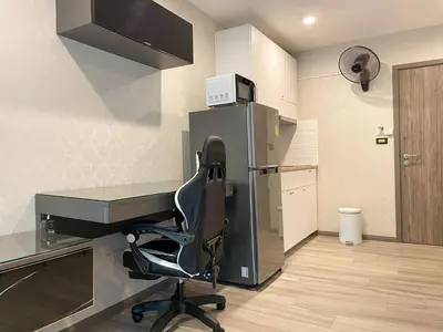 a office with a desk and a chair in a room at 1 br Cozy Orchid at The Title Nai Yang in Nai Yang Beach