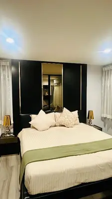 a bedroom with a large bed with a black headboard at 1 br Cozy Orchid at The Title Nai Yang in Nai Yang Beach