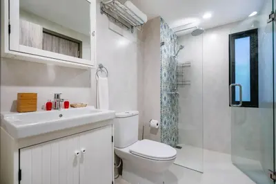 a bathroom with a toilet and a sink and a shower at 1 br Cozy Orchid at The Title Nai Yang in Nai Yang Beach