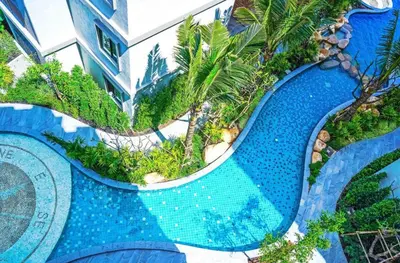 an aerial view of a pool at a resort at 1 br Cozy Orchid at The Title Nai Yang in Nai Yang Beach