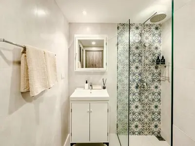 a bathroom with a sink and a shower at Strelitzia Tropical Living at Title Nai Yang in Nai Yang Beach
