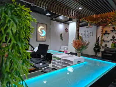 an office with a swimming pool and a desk with a computer at Le Moon in Patong Beach