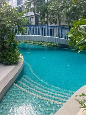 a large blue swimming pool with a white fence at Luxury cosy condo in Kathu centre in Kathu