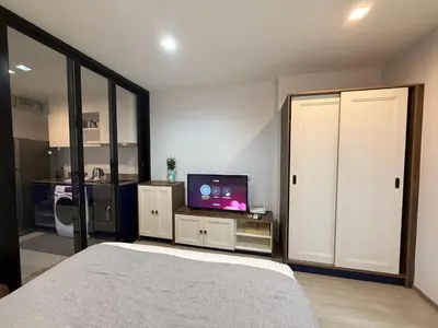 a bedroom with a bed and a tv in it at Luxury Resort Style 1 Bedroom Studio near Central in Phuket Town