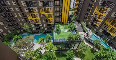 an aerial view of a swimming pool in a city at Luxury Resort Style 1 Bedroom Studio near Central in Phuket Town